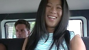 Asian lady Sunshine is showing her natural boobs in the car